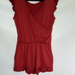 Romper Burnt orange ruffle cap sleeves removable bra pads and pockets size large
